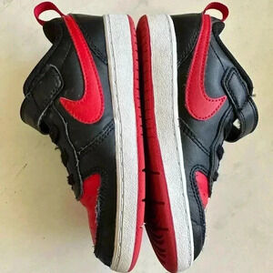Black and red Nike Kids shoes
